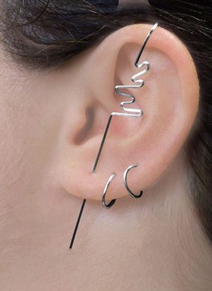 View of a models ear with a bolt design ear climber style earring. | Ear Curls, Ear Climbers