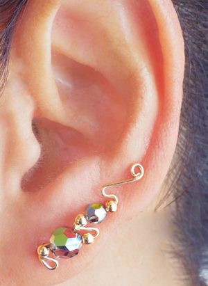 Ear climber style earrings with textured beads that are different sizes. | Ear Curls, Ear Climbers