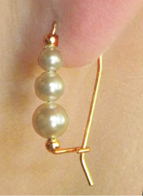 Gold earring with three different sized pearls. | Ear Curls, Ear Climbers