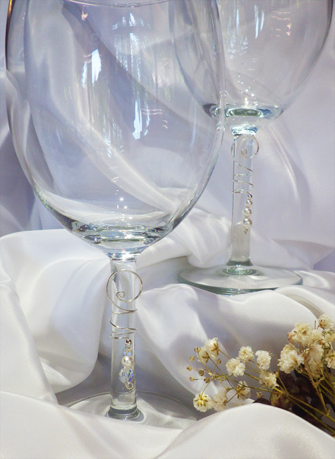 Two wine glasses with Wine Curls wedding charms on them. One with three pearls, the other with a pearl and crystal. | Ear Curls, Ear Climbers